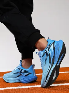 Detailed view of blue professional carbon plate running shoes on a running track