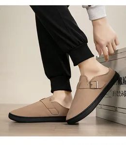 Close-up of warm fleece-lined khaki clogs with adjustable buckle strap.