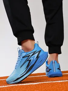Side view of professional blue carbon plate running shoes for men on athletic track