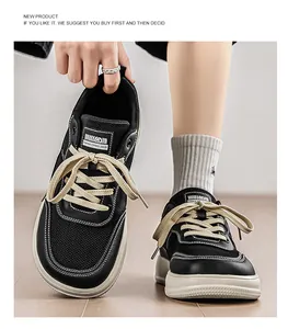 Close-up of stylish black wide-toe sneakers featuring breathable mesh and beige laces