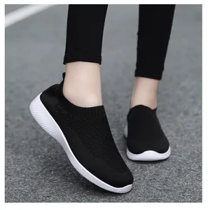 Detailed view of lightweight women's black fly-knit elastic sock shoes for casual walking