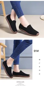 Casual black suede loafers for women with thick textured brown soles for comfort