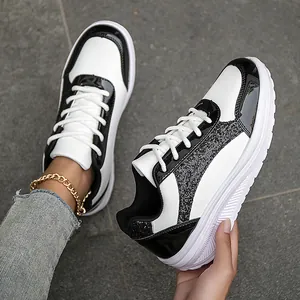Fashionable black and white color-block women's sneakers with glitter details and white laces