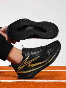 Detail of black and gold professional carbon plate running shoes showing outsole grip