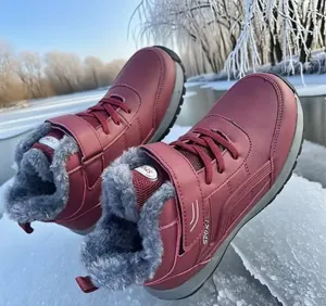 Side view of waterproof wine red snow boots with warm faux fur lining and non-slip sole