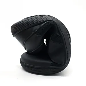 Close-up of flexible sole on retro black casual sneakers showing soft material