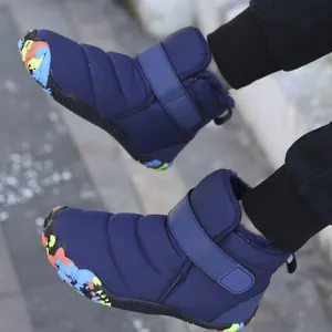 Blue children's mid-top snow boots with warm fleece lining and colorful patterned soles