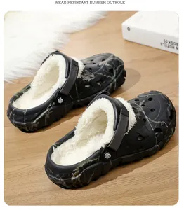 Detail view of black camouflage clogs with warm white fleece lining and rubber sole