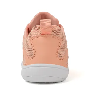 Rear view of breathable peach-colored mesh sneakers with a white barefoot sole.
