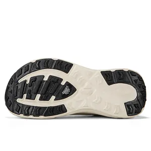 Detailed view of the anti-slip outsole of a wide-toe athletic shoe with tread pattern