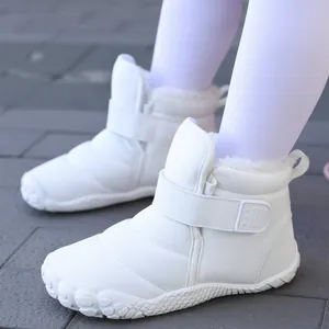 Cozy white children's winter snow boots with warm plush lining and secure velcro strap
