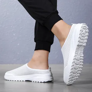 Close-up of white breathable mesh slip-on walking shoes with a soft rubber sole