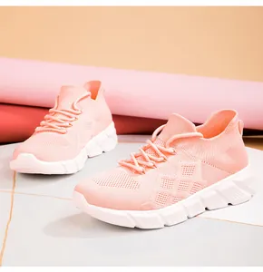 Side detail view of pink knitted breathable walking sneakers with chunky platform soles