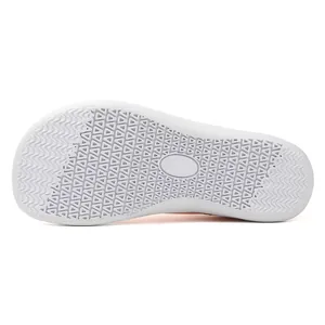Macro detail view of white non-slip rubber outsole for wide toe barefoot sneakers