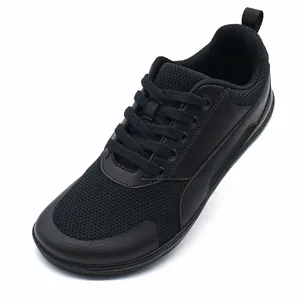 Versatile all-black retro casual sneakers for men and women featuring breathable mesh upper