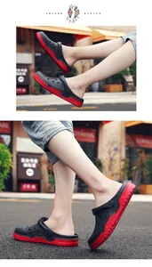 Outdoor lifestyle view of non-slip clogs with thick red soles and black uppers