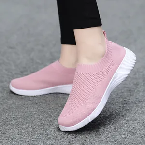 Pink women's flyknit slip-on walking shoes with breathable lightweight mesh and white sole