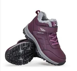 Detailed macro view of purple fleece-lined winter snow boots with rugged anti-slip rubber sole