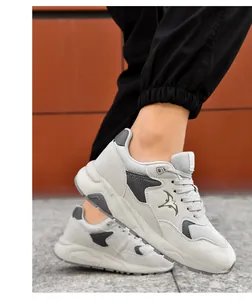 Close-up side view of grey height increasing men's casual sneakers for outdoor walking