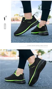 Detail view of lightweight breathable black running shoes with vibrant neon green accents