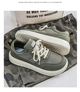 Detail of olive green wide-toe sneakers with breathable mesh and thick white soles