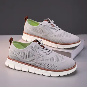 Detailed view of breathable gray mesh sneakers with a lightweight white chunky sole