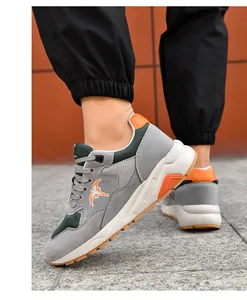 Close-up detail of men's grey and green casual sneakers with 8cm height increasing sole