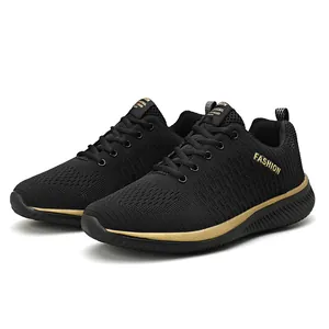 Detailed view of black breathable mesh running shoes with elegant gold trim accents.