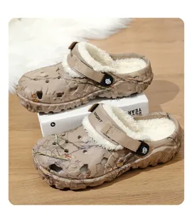 Detailed close-up view of camouflage clogs featuring warm white fleece lining and SPORT strap
