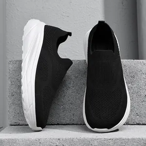 Breathable fly-knit slip-on sneakers for men with wide toe and thick white sole.