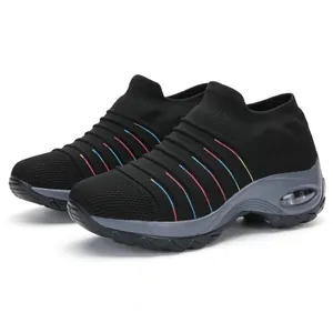 Close-up of black knit sock sneakers with colorful stripes and air cushion sole