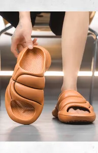 Detail shot of men's thick-soled EVA cloud slides showing soft texture and comfort.