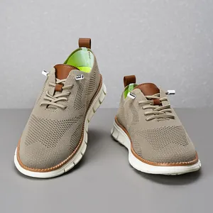 Close-up of beige breathable mesh loafers for men featuring brown leather accents