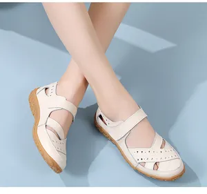 Comfortable cream genuine leather nurse sandals featuring a breathable hollow cutout design