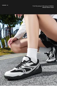 Vista detallada de zapatillas de deporte exteriores transpirables negras y blancas en asfalto