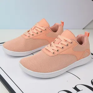 Detailed view of breathable peach mesh sneakers with wide toe barefoot design