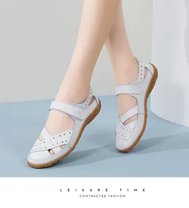 Close-up detail of breathable grey leather women sandals featuring a comfortable velcro strap