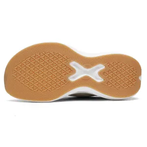 Detail view of the durable gum rubber outsole with anti-slip tread and X-shaped shank