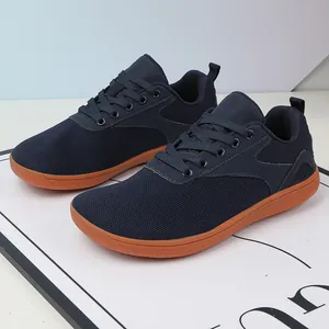 Navy blue fly-knit barefoot sneakers with flexible gum sole for sports and leisure