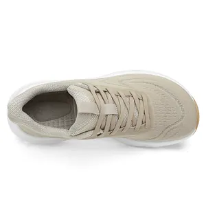 Top view of breathable fly-knit running shoes with wide-toe design and beige mesh