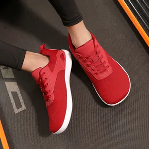 Vibrant red breathable knit barefoot sneakers with a wide toe box for men and women