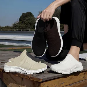 Lightweight fly-woven casual slip-on mules with comfortable popcorn sole for daily wear.