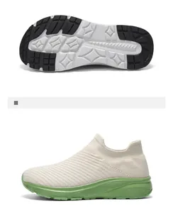 Detail view of breathable flying knit sock shoes with green sole and wide toe design.