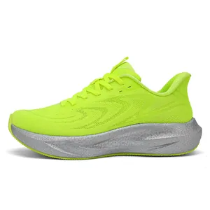Side view of lime green breathable knit running shoes with thick silver cushioned sole