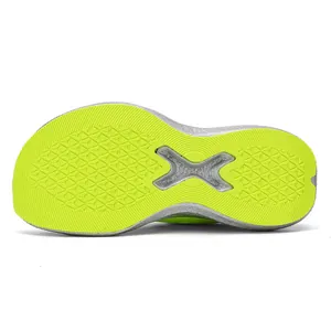 Detailed macro view of neon green running shoe outsole featuring silver carbon plate