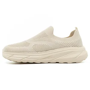 Detailed side view of a beige men's breathable flyknit slip-on sneaker with wide toe box