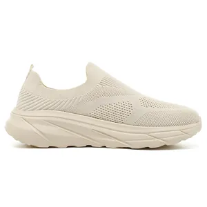 Side view of breathable mesh slip-on walking shoes for men in cream color.