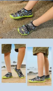 Detail view of quick-dry children's water shoes with non-slip soles in beach scene