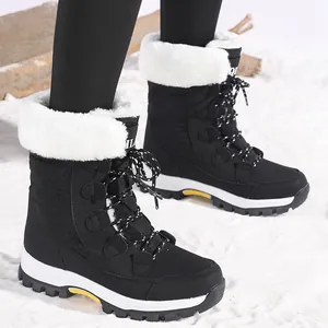 Stylish black women's snow boots with plush white faux fur lining and durable non-slip sole