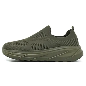 Close-up side view of olive green breathable knit slip-on sneakers with thick soles